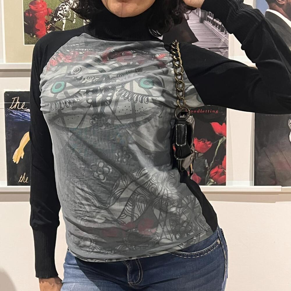 black and grey long sleeve mesh top with abstract graphic print
